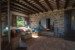 THE LIVING ROOM WITH THE ANCIENT  TUFF ARCHWAY